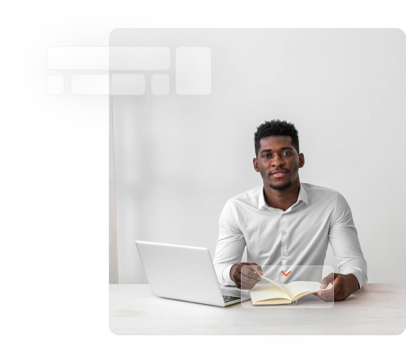 Yound man sitting at the study table with a book opened